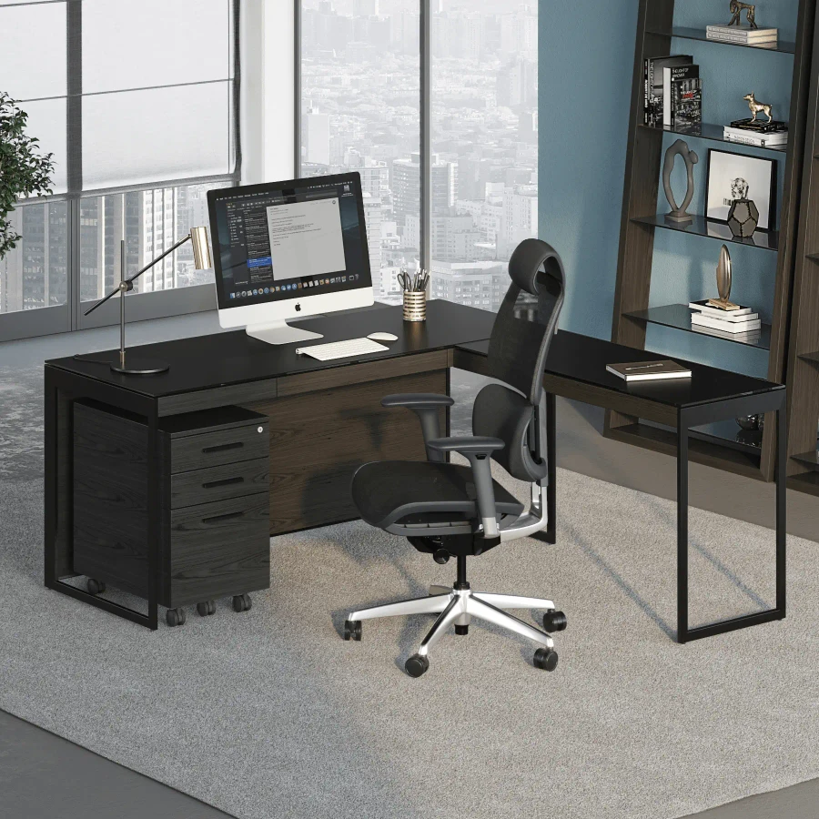 CHARCOAL - Modern L-shaped black wood office desk with matching file cabinet and ergonomic chair, angled front view.