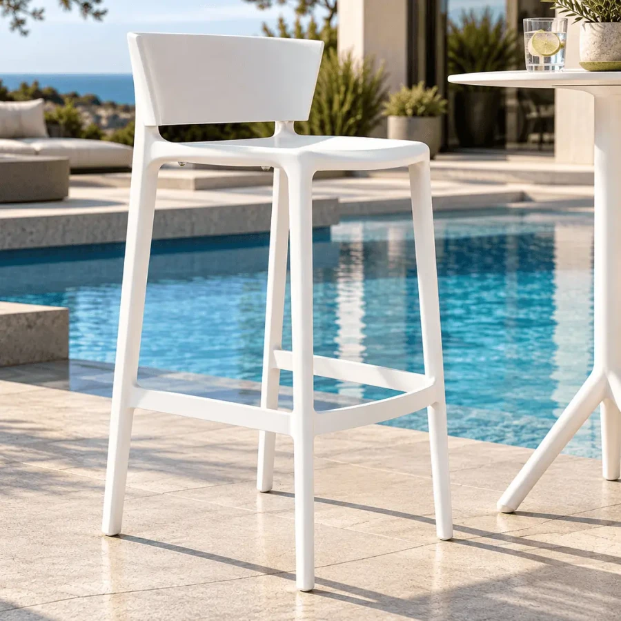 WHITE - Vondom Africa Counter Stool, modern white injection polypropylene, outdoor poolside setting, three-quarter side view.