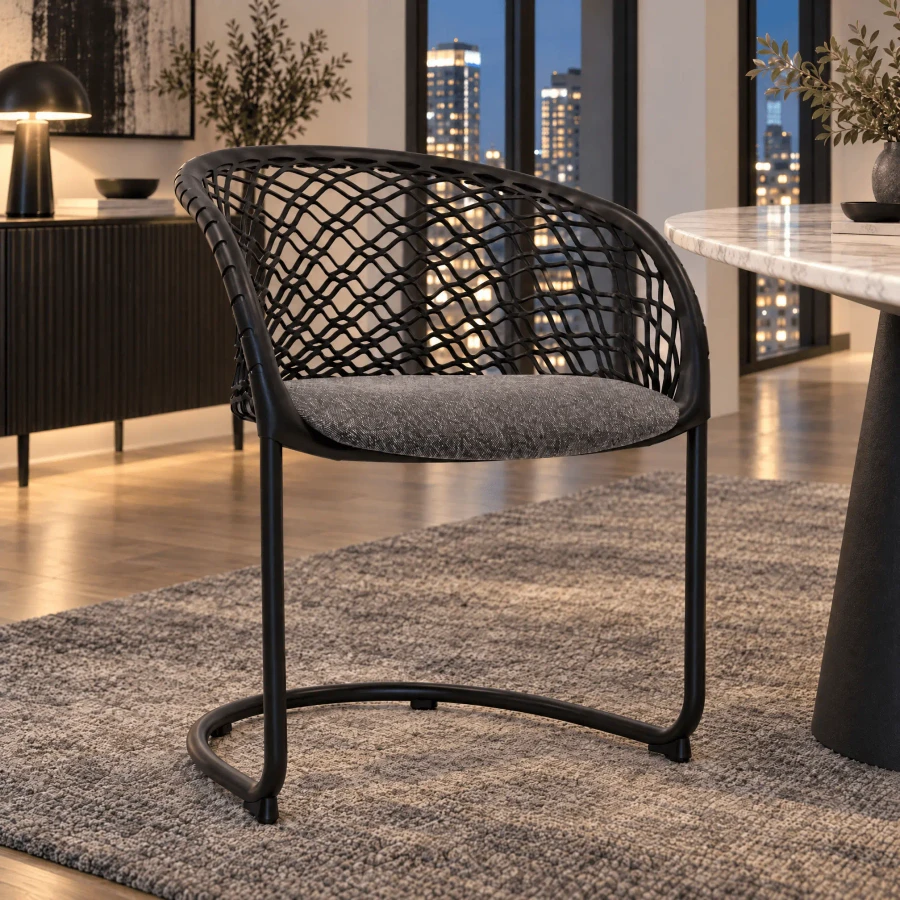 P47 Arm Chair, modern style, black lacquered metal frame, flax/black fabric seat, woven back, 3/4 view in dining room.