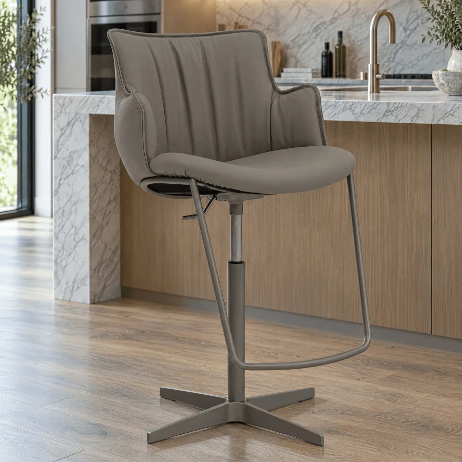 Cattelan Rihanna-x Swivel Bar Stool in Castoro Soft Leather with Titanium Embossed Steel Base, side view in kitchen setting.