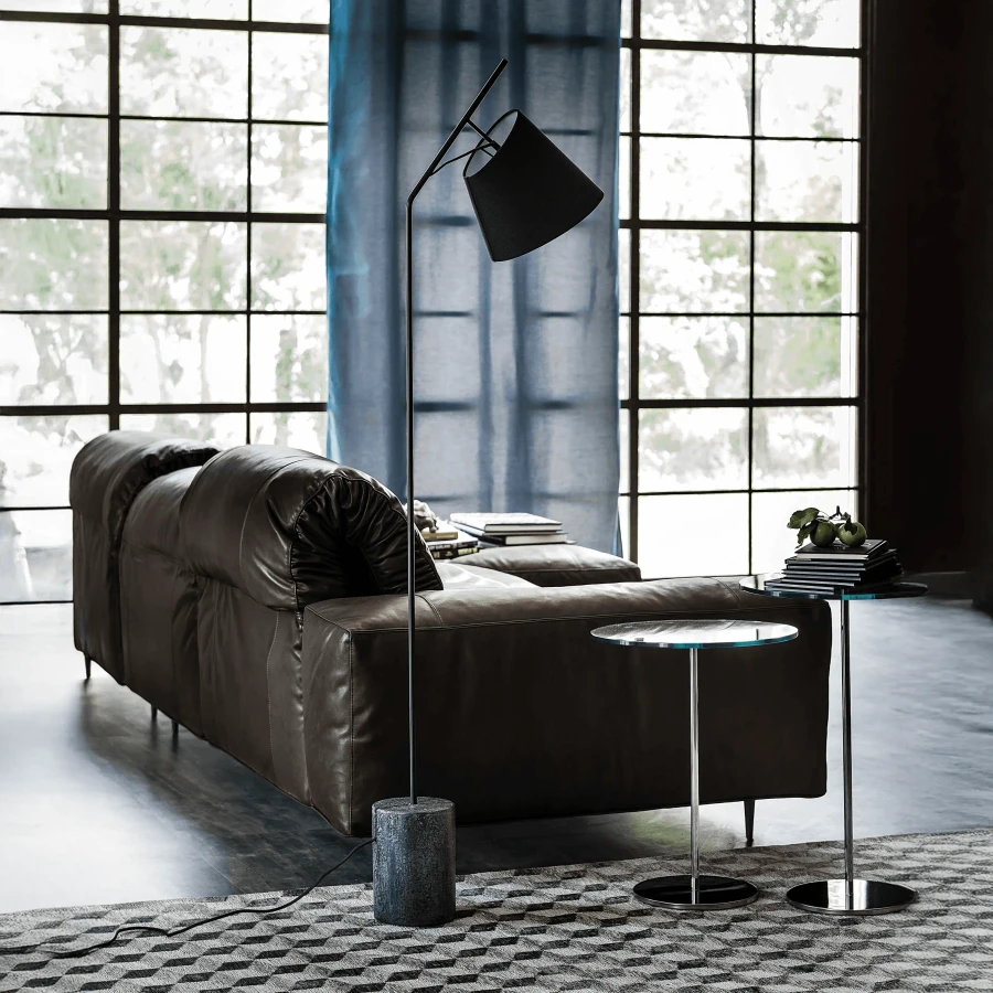 Cattelan Karibu Floor Lamp, matt black stem and shade, black concrete base, modern style, living room, side angle view.