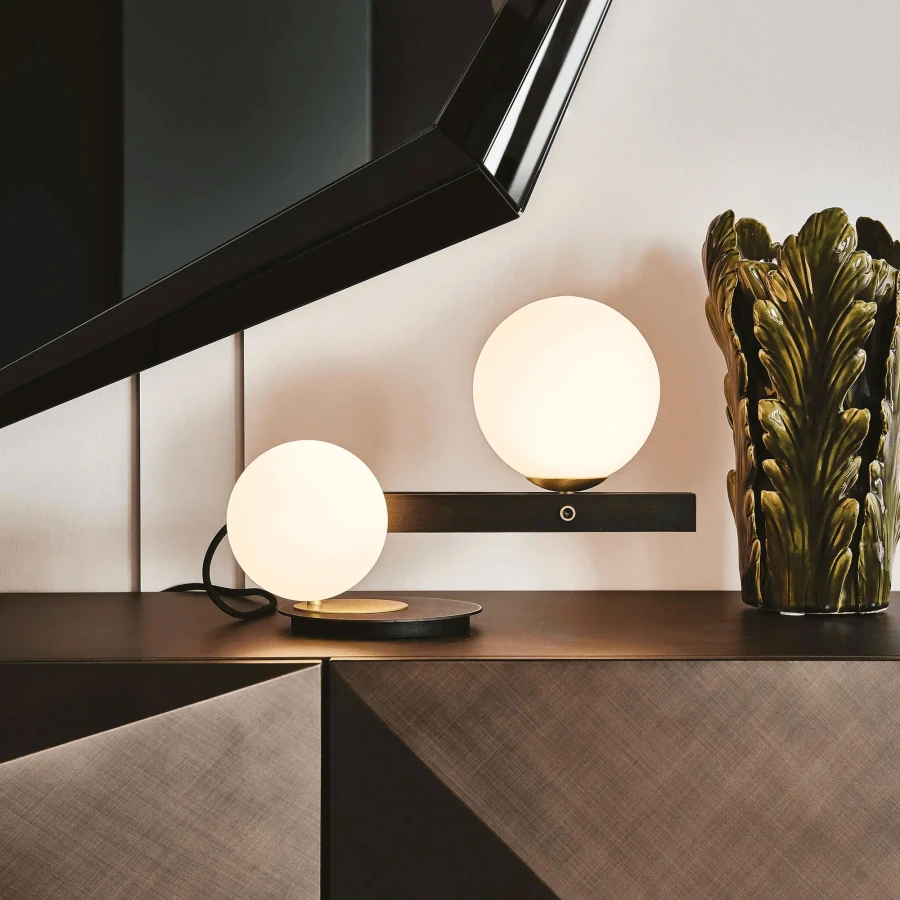 Cattelan Planeta Table Lamp, modern style, burnished steel and white blown glass globes, living room, side view.