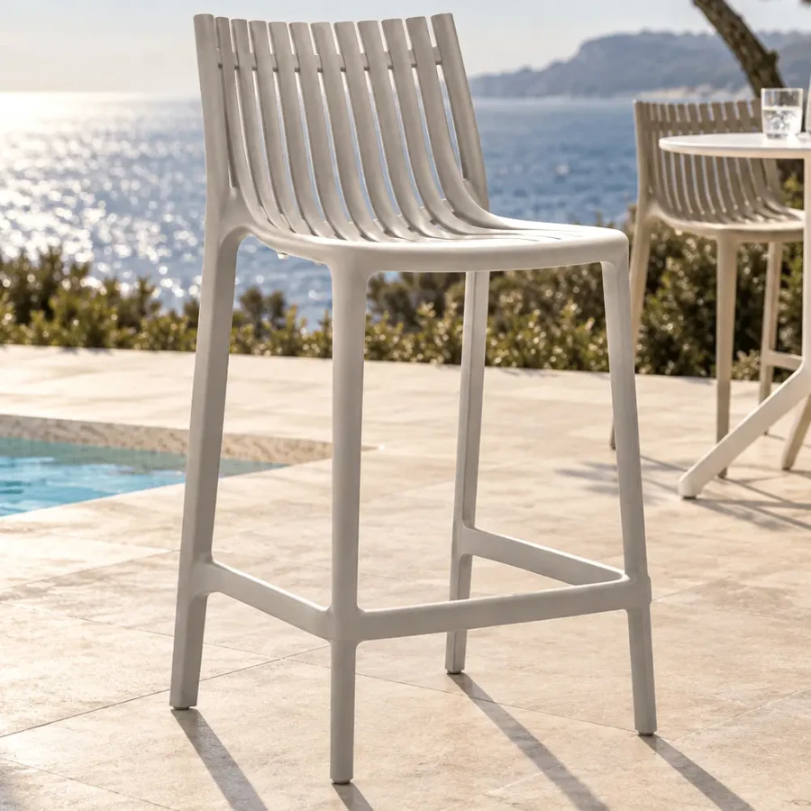 ECRU - Vondom Ibiza Counter Stool, modern ecru injection polypropylene bar stool with slatted back, 3/4 view, outdoor patio setting