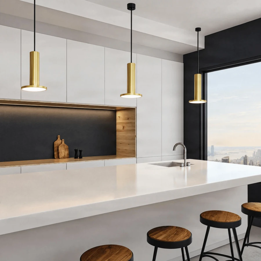 BRASS - Three Pablo Cielo Xl Pendant lights in brass, modern style, hanging over a white kitchen island, eye-level lifestyle view.