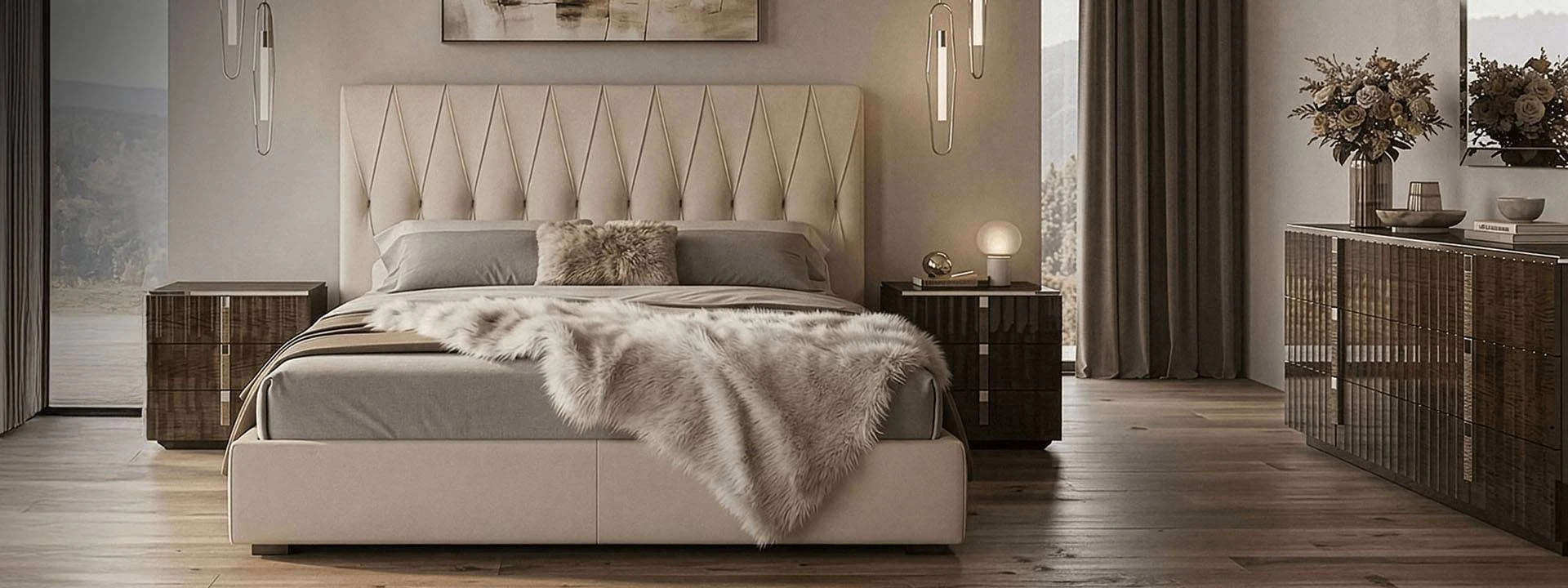 Modern upholstered bed with dark wood frame and layered grey bedding in a sunlit room