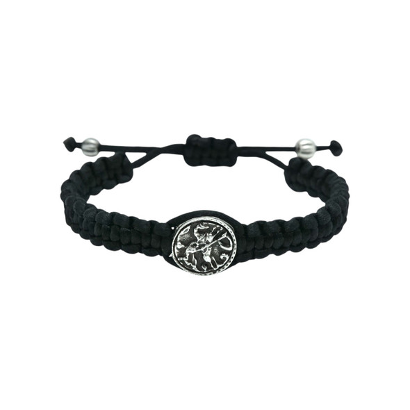 Bracelet made of black paracord and featuring a medallion of Saint George at its center. 