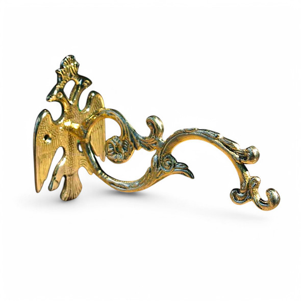 Solid brass wall bracket with Byzantine double-headed eagle design; used to hang vigil lamps or censers.