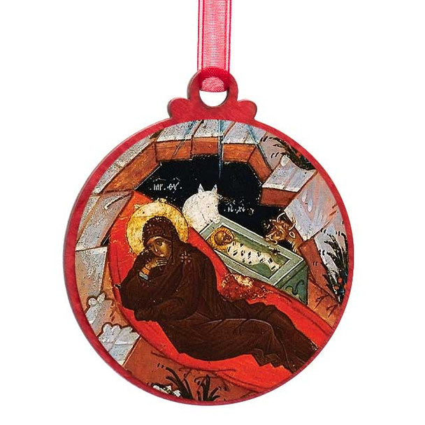 Circular ornament showing Virgin Mary lying beside baby Jesus in a manger, both with golden halos.