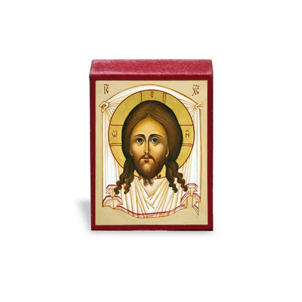 The Holy Face of Christ seen imprinted on a white cloth.