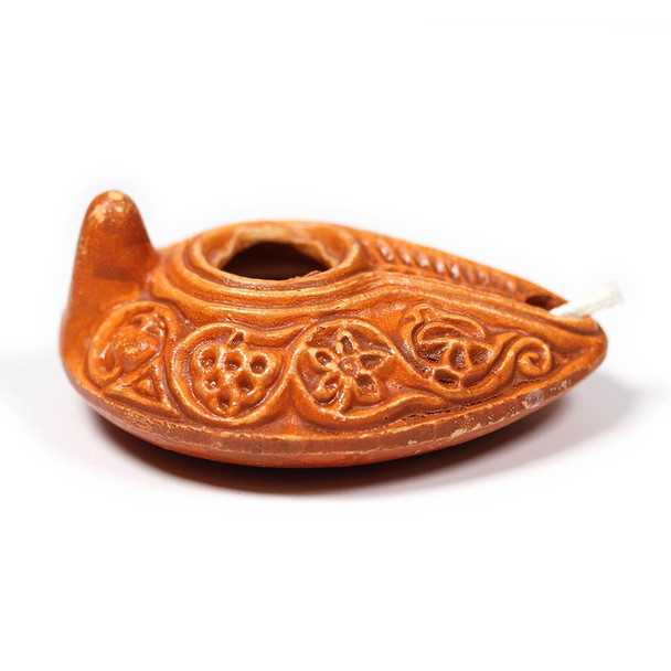 Handmade clay oil lamp from Bethlehem, styled after biblical lamps; burns olive oil with included wick. Handmade clay oil lamp from Bethlehem, styled after biblical lamps; burns olive oil with included wick.