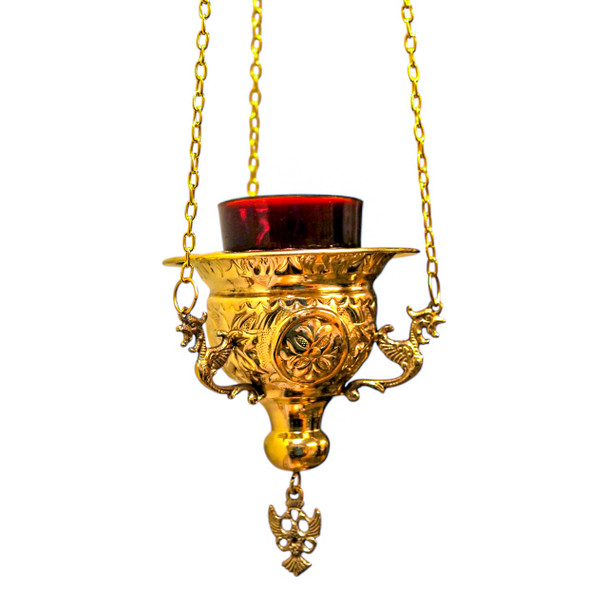 Brass hanging vigil lamp with red glass votive and chain; ideal for illuminating icons in prayer corners or churches. Brass hanging vigil lamp with red glass votive and chain; ideal for illuminating icons in prayer corners or churches.