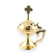 A brass incense burner with a cross on top. The burner has a round base, a handle on the side, and several small cross-shaped cutouts around the lid.