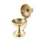 Brass incense burner with hinged lid and cross-shaped cutouts.