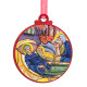 Circular ornament showing Virgin Mary lying beside baby Jesus in a manger, both with golden halos.