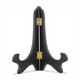 A black icon display stand with brass fittings