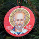 round ornament with icon of saint Nicholas 