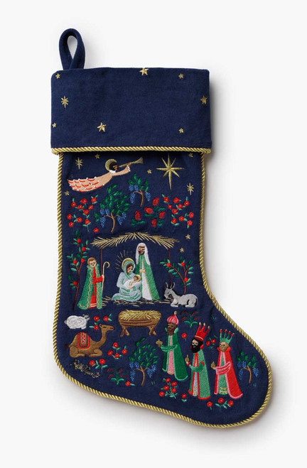 Full view of Nativity embroidered Christmas stocking with gold trim and starry cuff