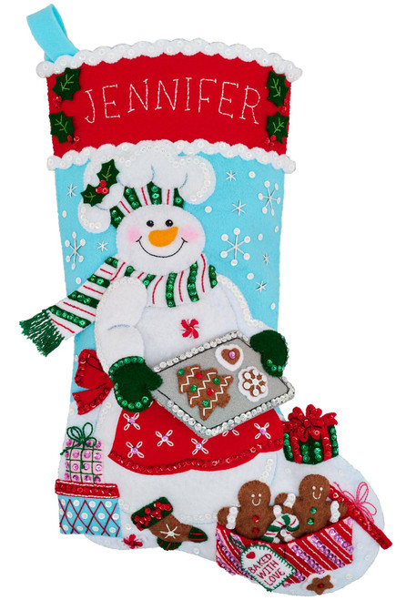 Bucilla Homemade Holiday Cheer personalized felt Christmas stocking kit featuring a snowman baker with gingerbread cookies, gifts, and holiday treats