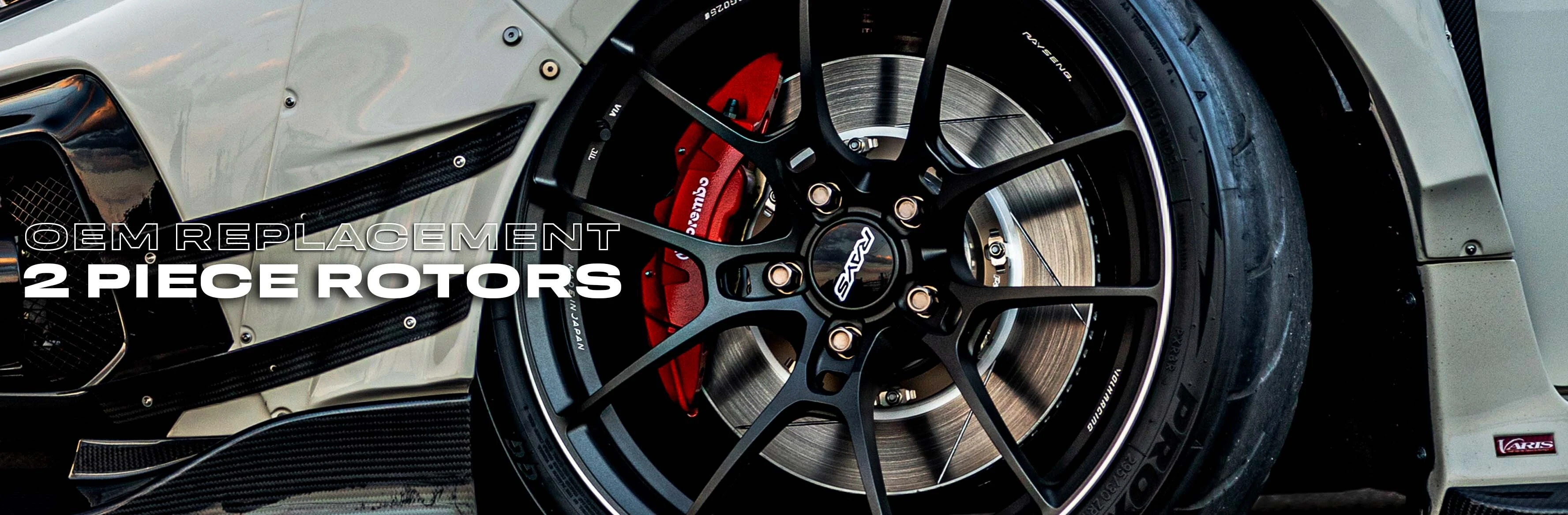 Paragon OEM replacement 2 piece rotors behind a black wheel