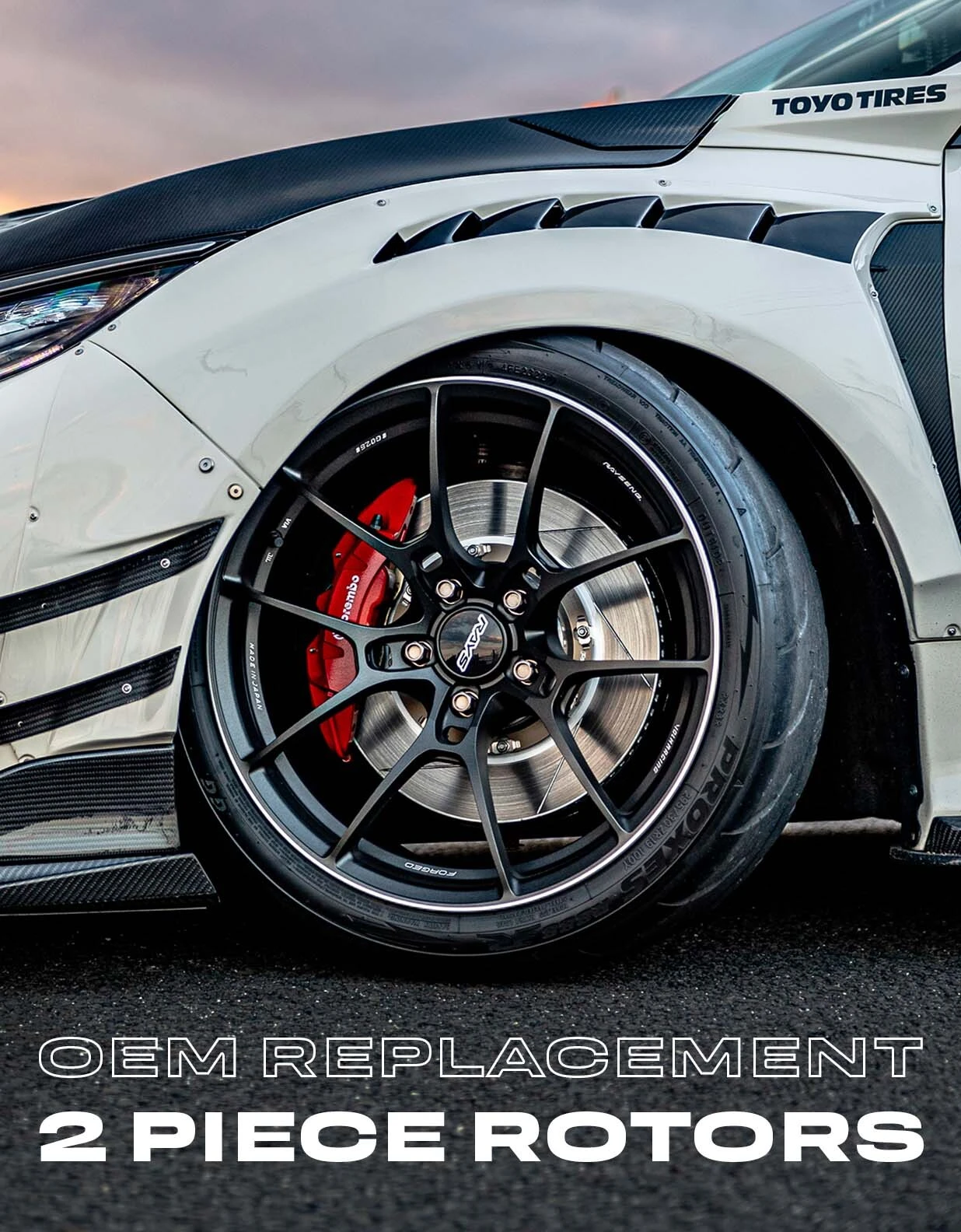 Paragon OEM replacement 2 piece rotors behind a black wheel