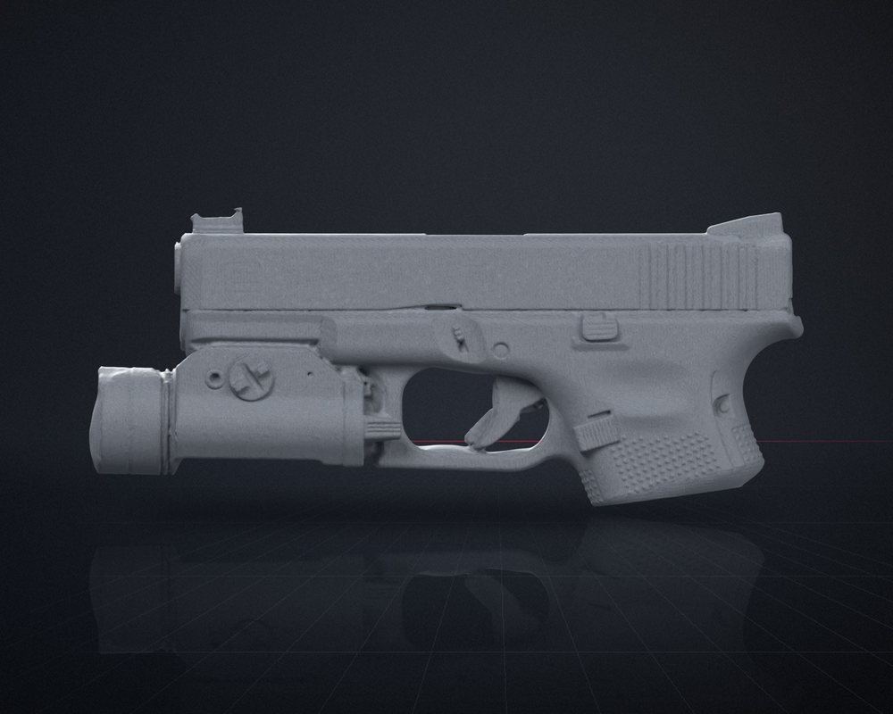 A raw 3D scan of a Glock 19 Gen 5 with a Streamlight TLR-1, showing the scanned surface