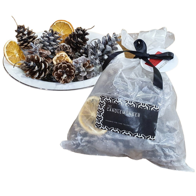 Fragrant pinecone fire lighters made with cones from the Kentish countryside, natural hemp and beeswax wicks and hand-dipped in pure soy wax scented with essential oils - providing a magical festive aroma of cinnamon, clove and sweet orange.