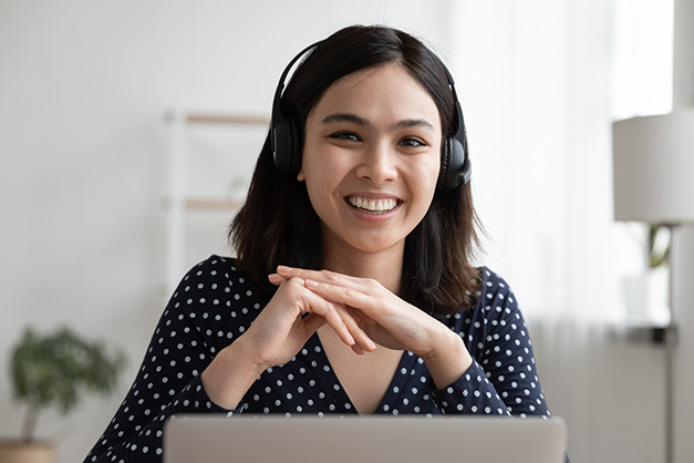 Dolbey Fusion Text Woman using headset and computer