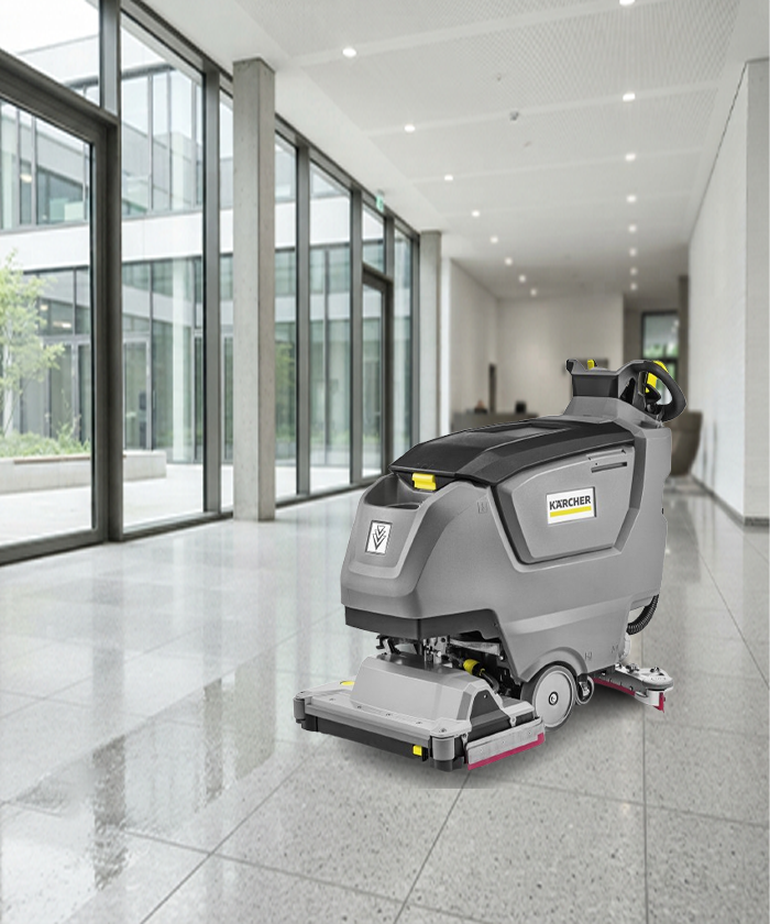 Kärcher B 50 W Bp walk-behind scrubber in a commercial building lobby