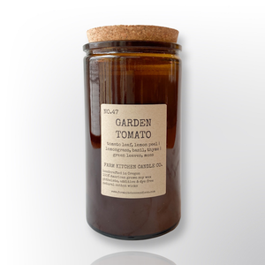 Handcrafted by Farm Kitchen Candle Co. Garden Tomato scented pure soy candle in a tall amber apothecary jar with a cork top. Handcrafted by Farm Kitchen Candle Co. Garden Tomato scented pure soy candle in a tall amber apothecary jar with a cork top.