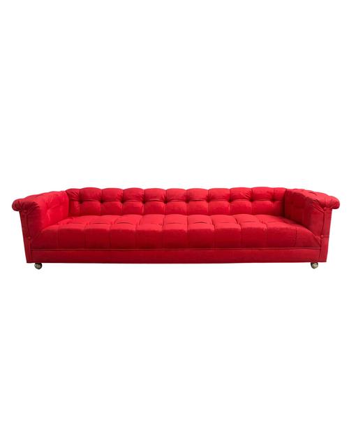 Red chenille party sofa with tufted cushions and rolled arms, isolated on a white background.