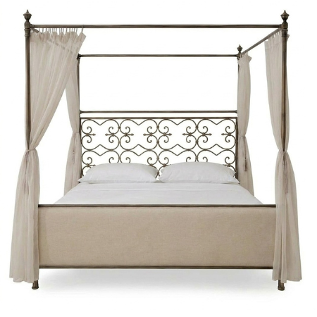 Valencia canopy bed with antique bronze metal frame, scrollwork headboard, and upholstered footboard