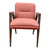 Coralí coral‑upholstered boutique armchair with angular wooden legs on white background.”