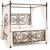 Luxury metal canopy bed featuring decorative scroll details and an elegant four-poster frame