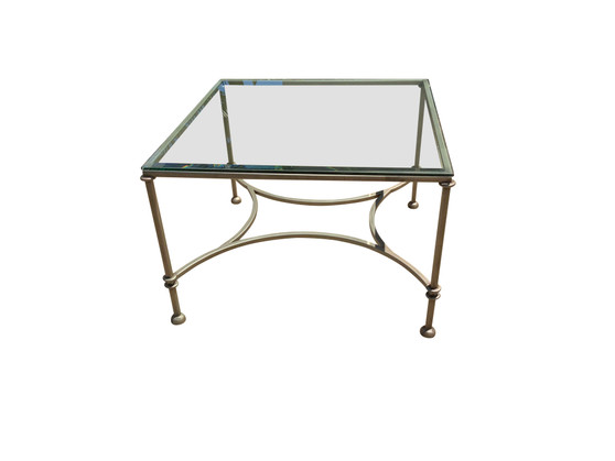 Front image of a Hollywood regency table, glass table, living room table, luxury furniture