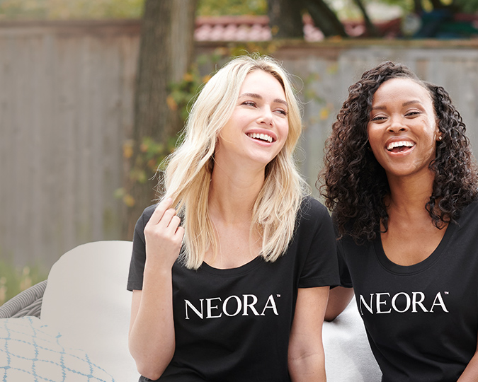 People wearing Neora shirts