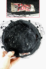 Black fabric and raffia straw mini pillbox hat 1960s with polka dot veil flat crown
