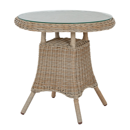 Amalfi Outdoor Bistro Table with glass top, styled with a teacup and potted herb on a patio
