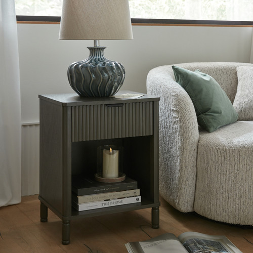 Reed 1 Drawer Cabinet styled beside an armchair with a table lamp and books