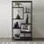 Large Black Multi Shelf Unit styled with plants, vases, books and decorative objects against a white wall