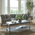 Serene 1 Drawer Side Table styled in a living room beside a grey sofa and coffee table