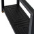 Close-up of the Lennox Black Console Table's lower shelf detailing and brushed brass foot cap
