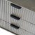 Close-up of the Reed 3 Drawer Bedside Table's fluted drawer fronts and recessed handles