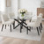 Monza Rectangular Glass Dining Table styled with upholstered dining chairs and a rose centrepiece