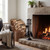 Black companion set beside a stone fireplace