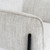 Close-up of the Zephra Chair's seat piping and leg joint detail