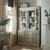 Delphine Sliding Glass Dresser Top styled in a living room with curtains and a console table