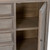 Close-up of the Delphine 2 Door 4 Drawer Large Dresser Base's open cupboard door showing the interior shelving
