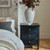 Contour 3 Drawer Side Table styled beside a bed with a vase and books on top