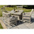 Provence Outdoor Dining Chairs styled around a table with wine and cheese in a garden setting