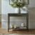 Reed 2 Drawer Console styled in a hallway with a vase, candles, and books